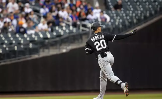 Chicago White Sox third base Miguel Vargas (20) celebrates his two run home run during the first inning against the New York Mets, Tuesday, May 27, 2025, in New York. (AP Photo/Angelina Katsanis)