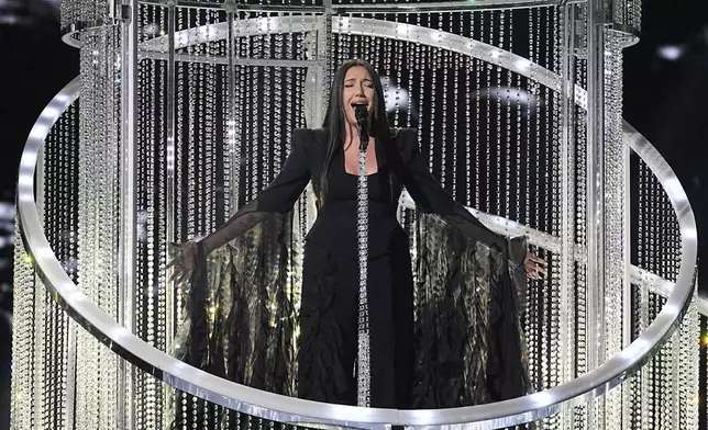 Yuval Raphael from Israel performs the song "New Day Will Rise" during the dress rehearsal for the second semi-final of the 69th Eurovision Song Contest, in Basel, Switzerland, Wednesday, May 14, 2025. (AP Photo/Martin Meissner)