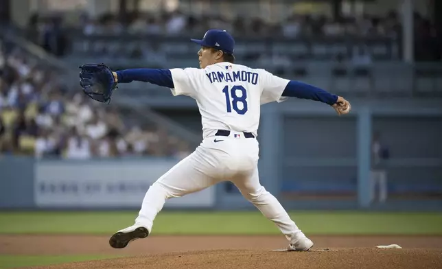 Los Angeles Dodgers starting pitcher Yoshinobu Yamamoto delivers a pitch during the first inning of a baseball game against the Arizona Diamondbacks in Los Angeles, Tuesday, May 20, 2025. (AP Photo/Kyusung Gong)