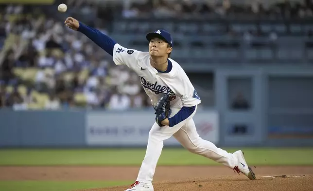 Los Angeles Dodgers starting pitcher Yoshinobu Yamamoto delivers a pitch during the first inning of a baseball game against the Arizona Diamondbacks in Los Angeles, Tuesday, May 20, 2025. (AP Photo/Kyusung Gong)