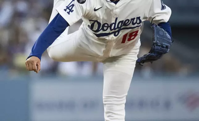 Los Angeles Dodgers starting pitcher Yoshinobu Yamamoto delivers a pitch during the first inning of a baseball game against the Arizona Diamondbacks in Los Angeles, Tuesday, May 20, 2025. (AP Photo/Kyusung Gong)