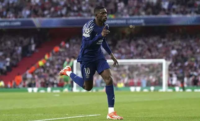 Paris Saint Germain's Ousmane Dembele celebrates after scoring the opening goal during the Champions League semifinal first leg soccer match between Arsenal and Paris Saint-Germain at Emirates Stadium in London, England, Tuesday, April 29, 2025. (Adam Davy/PA via AP)