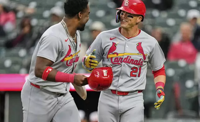 St. Louis Cardinals' Lars Nootbaar (21) celebrates with Jordan Walker, left, after hitting a two-run home run to score them both during the second inning of a baseball game against the Baltimore Orioles, Tuesday, May 27, 2025, in Baltimore. (AP Photo/Stephanie Scarbrough)