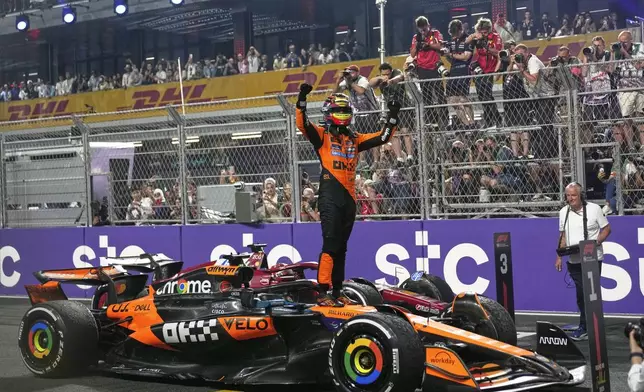 McLaren driver Oscar Piastri of Australia celebrates after winning the Formula One Saudi Arabian Grand Prix at the Jeddah Corniche Circuit in Jeddah, Saudi Arabia, Sunday, April 20, 2025. (AP Photo/Altaf Qadri)