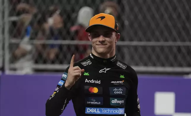 McLaren driver Oscar Piastri of Australia celebrates after winning the Formula One Saudi Arabian Grand Prix at the Jeddah Corniche Circuit in Jeddah, Saudi Arabia, Sunday, April 20, 2025.(AP Photo/Altaf Qadri)