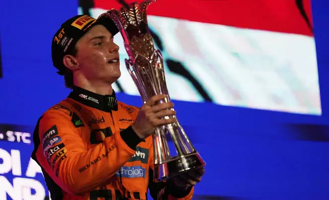 McLaren driver Oscar Piastri of Australia celebrates on the podium after winning the Formula One Saudi Arabian Grand Prix at the Jeddah Corniche Circuit in Jeddah, Saudi Arabia, Sunday, April 20, 2025. (AP Photo/Darko Bandic)