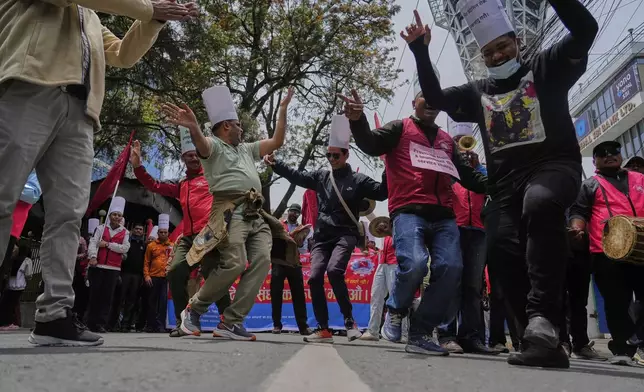 Workers affiliated with Communist Party of Nepal (Maoist Centre) participate in a May Day rally in Kathmandu, Nepal, Thursday, May 1, 2025. (AP Photo/Niranjan Shrestha)