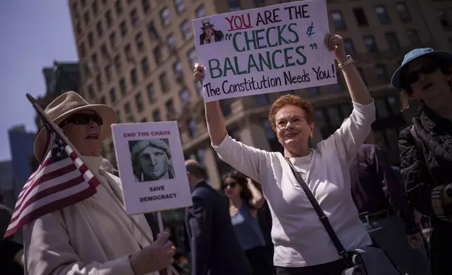 People take part in a May Day rally for the Rule of Law, Thursday, May 1, 2025 in New York. (AP Photo/Adam Gray)