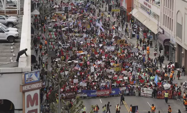 Demonstrators march during a May Day protest Thursday, May 1, 2025, in Los Angeles. (AP Photo/Jae C. Hong)