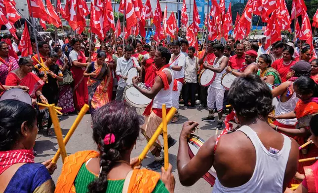 Members of Centre of India Trade Unions (CITU) beat drums and dance as they participate in a rally to mark May Day in Hyderabad, India, Thursday, May 1, 2025. (AP Photo/Mahesh Kumar A.)