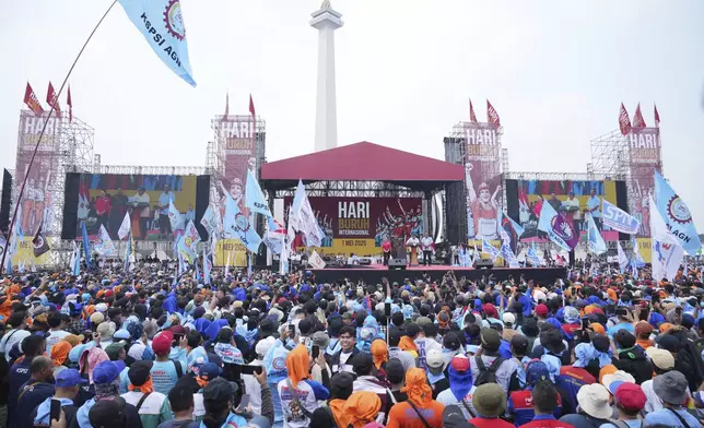 Crowd listen to Indonesian President Prabowo Subianto's speech during a May Day rally at the National Monument in Jakarta, Indonesia, Thursday, May 1, 2025. (AP Photo/Tatan Syuflana)
