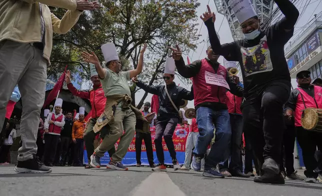 Workers affiliated with Communist Party of Nepal (Maoist Centre) participate in a May Day rally in Kathmandu, Nepal, Thursday, May 1, 2025. (AP Photo/Niranjan Shrestha)