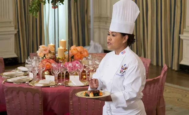 FILE - White House executive chef Cristeta Comerford shows the main course during a preview in the State Dining Room of White House in Washington, Sept. 24, 2015, for the state dinner of the visiting Chinese President Xi Jinping. (AP Photo/Manuel Balce Ceneta, File)