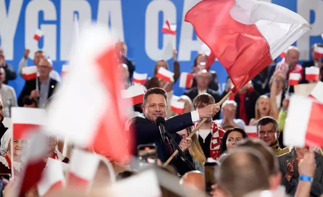 Warsaw's Mayor and presidential candidate Rafal Trzaskowski celebrates the exit poll results during presidential election night in Sandomierz, Poland, Sunday, May 18, 2025. (AP Photo/Aleksander Kalka)