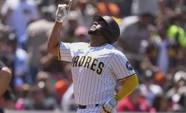 San Diego Padres' Elias Diaz celebrates after hitting a home run during the third inning of a baseball game against the San Francisco Giants Wednesday, April 30, 2025, in San Diego. (AP Photo/Gregory Bull)