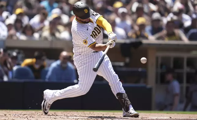 San Diego Padres' Elias Diaz hits a home run during the third inning of a baseball game against the San Francisco Giants Wednesday, April 30, 2025, in San Diego. (AP Photo/Gregory Bull)