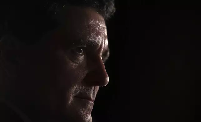 Presidential candidate Nicusor Dan speaks to media after polls closed in the first round of the country's presidential election redo in Bucharest, Romania, Sunday, May 4, 2025. (AP Photo/Eduard Vinatoru)