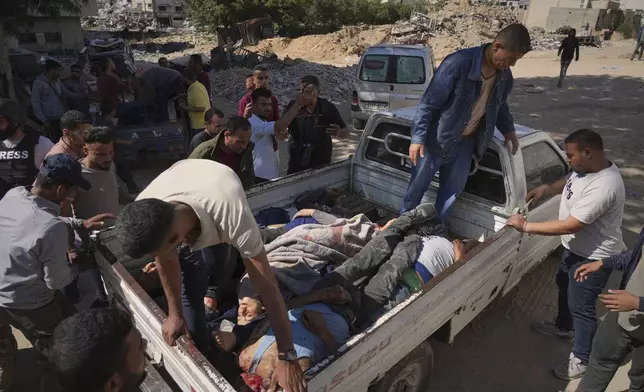 Bodies of some of the victims of an Israeli army strike on a restaurant, which killed at least 29 people, are transported from the scene to the Shifa hospital in Gaza City, Wednesday, May 7, 2025.(AP Photo/Jehad Alshrafi)
