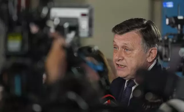 Presidential candidate Crin Antonescu speaks to media during a meeting with supporters after polls closed for the first round of the country's presidential election redo in Bucharest, Romania, Sunday, May 4, 2025. (AP Photo/Vadim Ghirda)