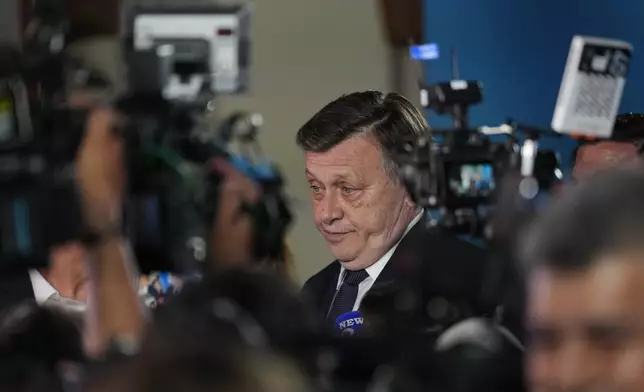 Presidential candidate Crin Antonescu speaks to media during a meeting with supporters after polls closed for the first round of the country's presidential election redo in Bucharest, Romania, Sunday, May 4, 2025. (AP Photo/Vadim Ghirda)
