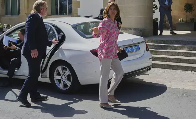 U.N. chief's personal envoy for Cyprus, Maria Angela Holguin Cuellar, arrives for a meeting with Cyprus' President Nikos Christodoulides at the Presidential Palace in the divided capital Nicosia, Cyprus, on Saturday, May 24, 2025. (AP Photo/Petros Karadjias)
