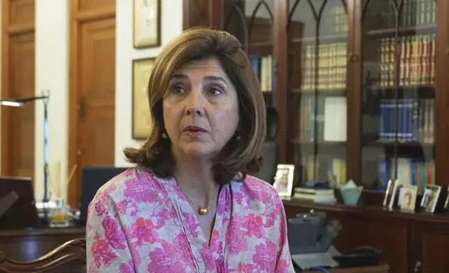 U.N. chief's personal envoy for Cyprus, Maria Angela Holguin Cuellar talks with the Cyprus' President Nikos Christodoulides during their meeting at the Presidential Palace in the divided capital Nicosia, Cyprus, on Saturday, May 24, 2025. (AP Photo/Petros Karadjias)
