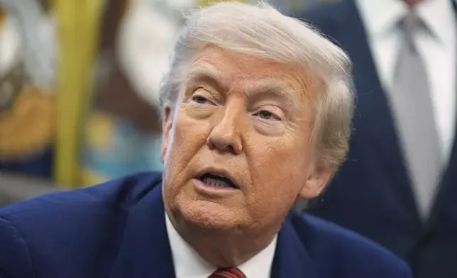 President Donald Trump speaks to reporters after signing executive orders regarding nuclear energy in the Oval Office of the White House, Friday, May 23, 2025, in Washington. (AP Photo/Evan Vucci)