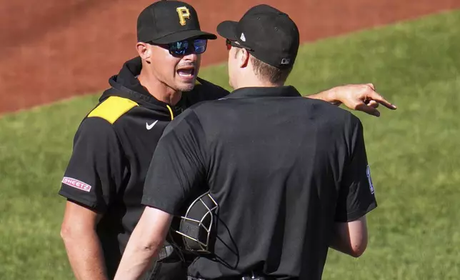 Pittsburgh Pirates manager Don Kelly, left, makes his point to umpire Clint Vondrak after being ejected during the sixth inning of a baseball game against the Atlanta Braves in Pittsburgh, Saturday, May 10, 2025. (AP Photo/Gene J. Puskar)