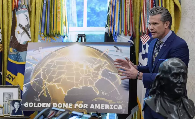 Defense Secretary Pete Hegseth speaks during an event with President Donald Trump in the Oval Office of the White House, Tuesday, May 20, 2025, in Washington. (AP Photo/Alex Brandon)