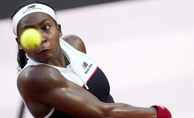 Coco Gauff of the US returns to Canada's Victoria Mboko during the Italian Open tennis tournament in Rome, Friday May 9, 2025. (Alfredo Falcone/LaPresse via AP)