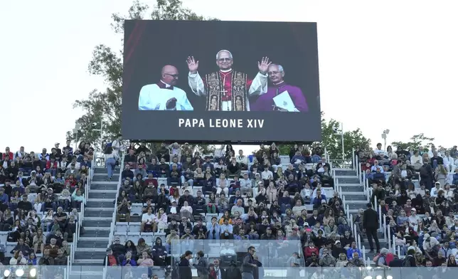 A screen flashes the news of new Pope Leo XIV, during the second round match between Italys' Fabio Fognini and Britain's Jacob Fearnley at the Italian Open tennis tournament, Thursday. May 8, 2025, in Rome. (Alfredo Falcone/LaPresse via AP)