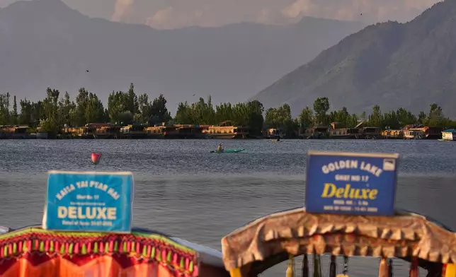 A Kashmiri man rows his wooden boat on his way back home on Dal Lake in Srinagar, in Indian controlled Kashmir, Saturday, May 10, 2025.(AP Photo/Dar Yasin)