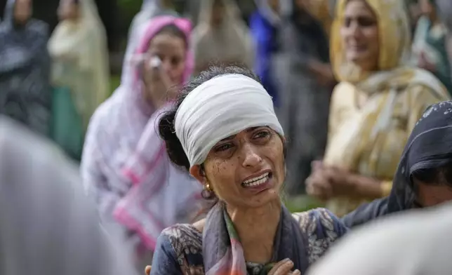Mother of Vihaan Barghava, 13, killed in Pakistani artillery shelling wails during cremation in Poonch along the Line of Control, Indian controlled Kashmir, Thursday, May 8, 2025. (AP Photo/Channi Anand)