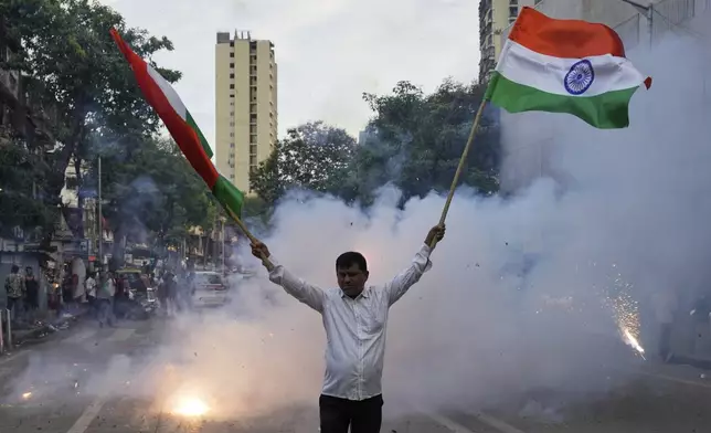 Shivsena party worker holding Indian national flag rally's in support of the Indian Army as they celebrate the success of 'Operation Sindoor', in Mumbai in Mumbai, India, Thursday, May 8, 2025. (AP Photo/Rajanish Kakade)