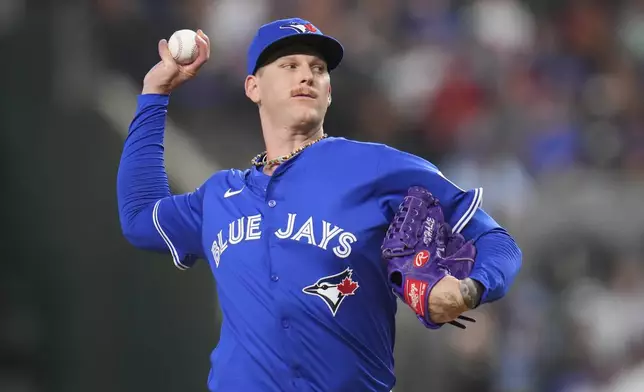 Toronto Blue Jays starting pitcher Bowden Francis throws a pitch to the Texas Rangers during the first inning of a baseball game Tuesday, May 27, 2025, in Arlington, Texas. (AP Photo/Julio Cortez)