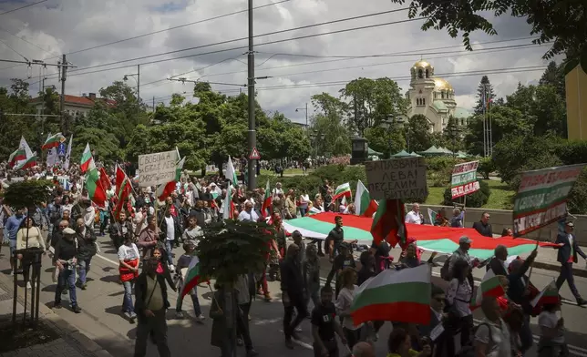 Thousands Bulgarians took on the streets of the capital, Sofia, and other major cities on Saturday to protest government plans to adopt the euro and to demand a referendum on the issue. Sofia, Saturday, May 31, 2025. (AP Photo/Valentina Petrova)