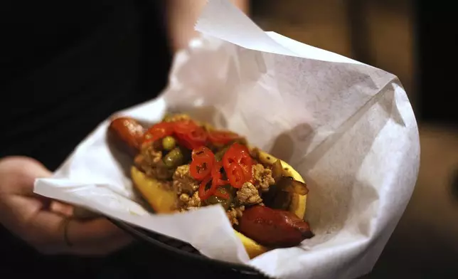 Shown is the The Cambodian Chili Dog at the Mawn restaurant in Philadelphia, Thursday, May 22, 2025. (AP Photo/Matt Rourke)
