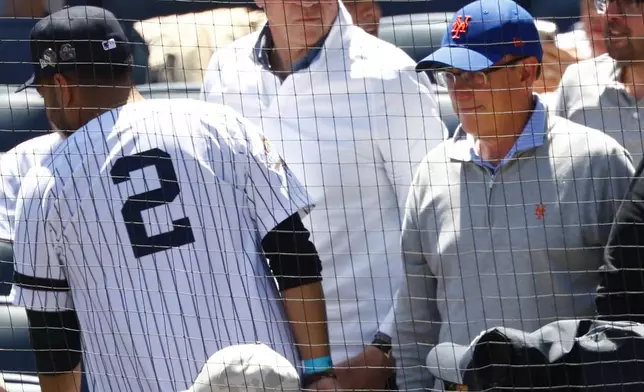 New York Mets owner Steve Cohen, right, attends the Subway Series baseball game against the New York Yankees at Yankee Stadium, Saturday, May 17, 2025, in New York. (AP Photo/Noah K. Murray)