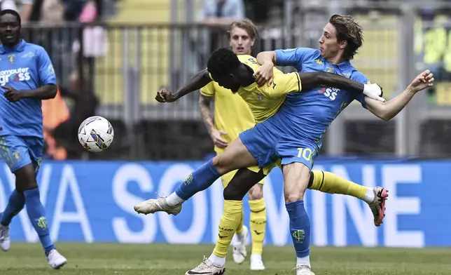 Empoli's Jacopo Fazzini, right, competes for the ball with Lazio's Boulaye Dia during the Italian Serie A soccer match between Empoli and Lazio at the "Carlo Castellani - Computer Gross Arena" Stadium in Empoli, Italy, Sunday, May 4, 2025. (LaPresse via AP)