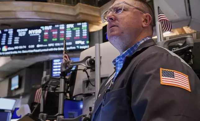 Trader Ryan Falvey works on the floor of the New York Stock Exchange, Tuesday, May 27, 2025. (AP Photo/Richard Drew)