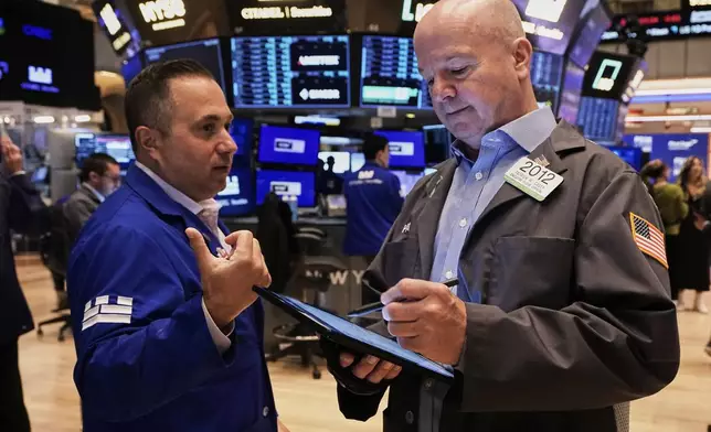 Specialist Gennaro Saporito, left, and trader Patrick Casey work on the floor of the New York Stock Exchange, Thursday, May 29, 2025. (AP Photo/Richard Drew)