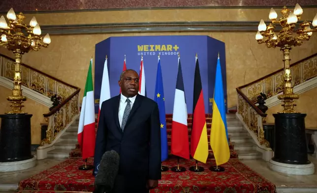 Britain's Foreign Secretary David Lammy speaks to the media as he hosts talks on Ukraine and the future of European security at Lancaster House in London, Monday, May 12, 2025. (Carlos Jasso/Pool Photo via AP)