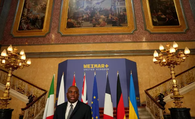 Britain's Foreign Secretary David Lammy speaks to the media as he hosts talks on Ukraine and the future of European security, at Lancaster House in London, Monday, May 12, 2025. (Carlos Jasso/Pool Photo via AP)