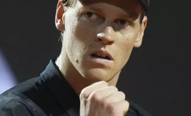 Italy's Jannik Sinner celebrates a winning point during a round of sixteen match against Argentina's Francisco Cerundolo at the Italian Open tennis tournament in Rome, Tuesday, May 13, 2025. (AP Photo/Andrew Medichini)