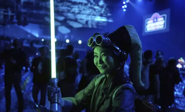 FILE - A Star Wars supporter poses for a photo during a fan convention called the Star Wars Celebration Japan in Chiba, near Tokyo, Friday, April 18, 2025. (AP Photo/Hiro Komae, File)