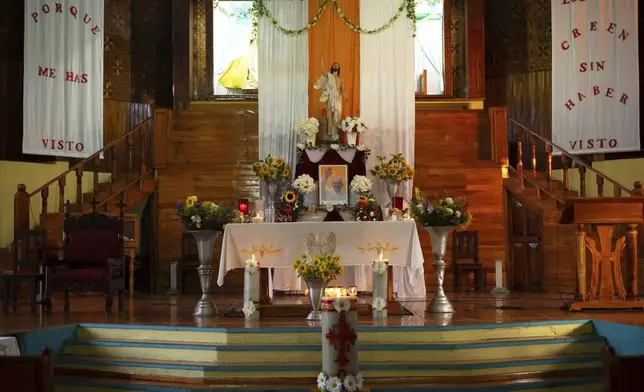 FILE - A photo of the late Pope Francis adorns an altar in Huitiupan, Mexico, Sunday, April 27, 2025. (AP Photo/Isabel Mateos, File)