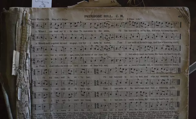 A 1911 edition of "The Sacred Harp," a shape-note hymnal from the 1800s, opened to song No. 43, "Primerose Hill," at the Sacred Harp Publishing Company and Museum in Carrollton, Ga., on Friday, March 21, 2025. (AP Photo/Jessie Wardarski)