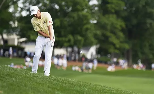 Matthew Fitzpatrick, of England, chips to the green on the 14th hole during the second round of the PGA Championship golf tournament at the Quail Hollow Club, Friday, May 16, 2025, in Charlotte, N.C. (AP Photo/George Walker IV)