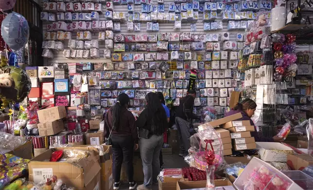 FILE - People shop at a party supply store in the Toy District of Los Angeles on April 9, 2025, where the majority of items are imported from China. (AP Photo/Jae C. Hong, File)
