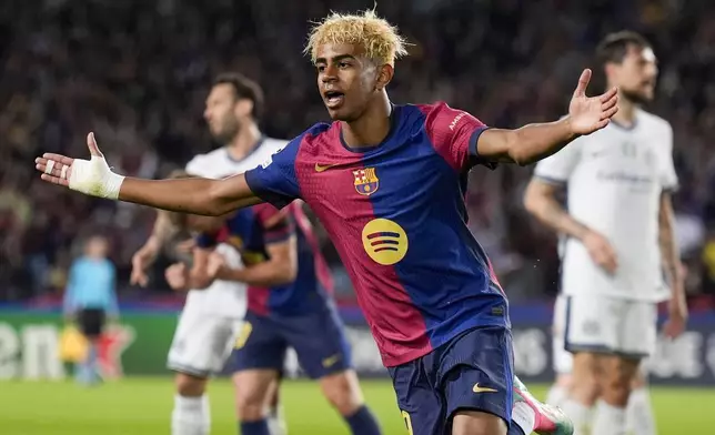 Barcelona's Lamine Yamal celebrates after scoring during the Champions League semifinal first leg soccer match between Barcelona and Inter Milan in Barcelona, Spain, Wednesday, April 30, 2025. AP Photo/Emilio Morenatti)
